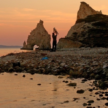 Greece, Cyclades. Kimolos. Faily affection in Mavrospilea beach. Sunset between the white rocks. © Maro Kouri